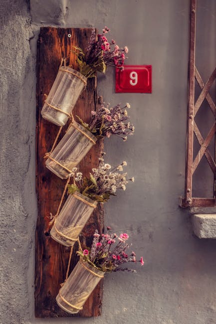11 : img_9 - Rustic wall with flower jars and number 9 plaque